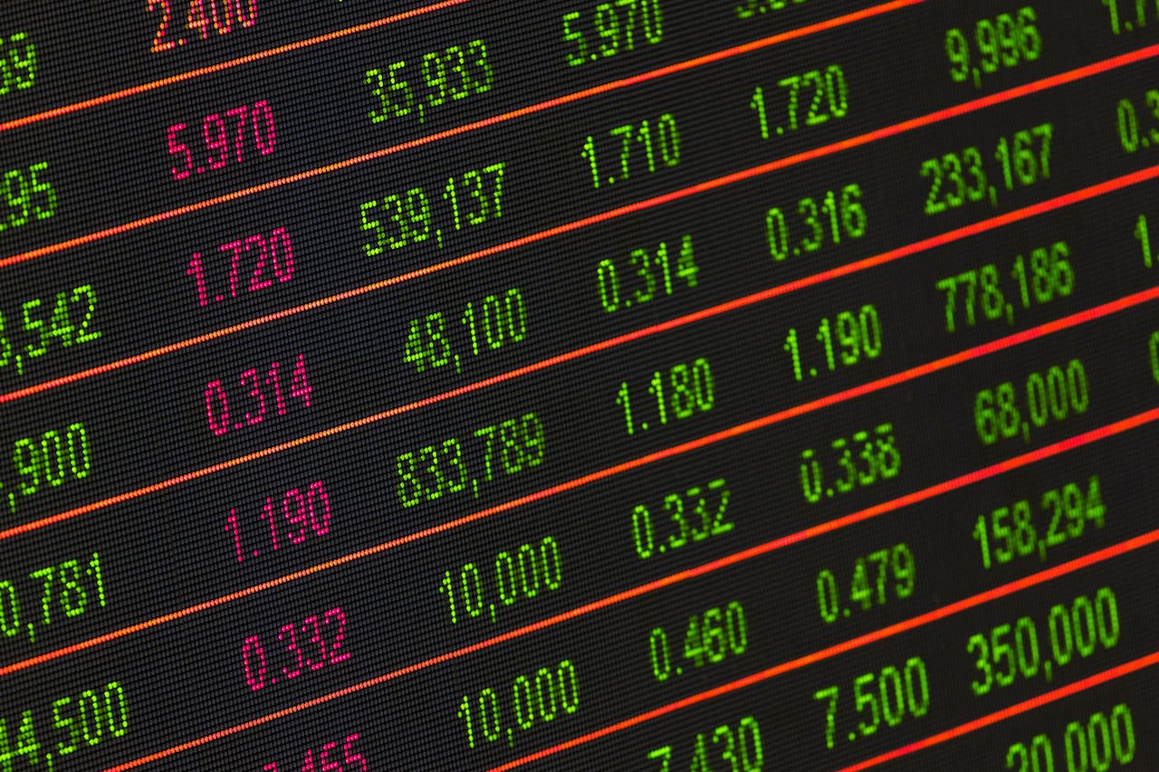 gallery-2 Close-up of a digital stock market data display showing colorful financial numbers and trends.