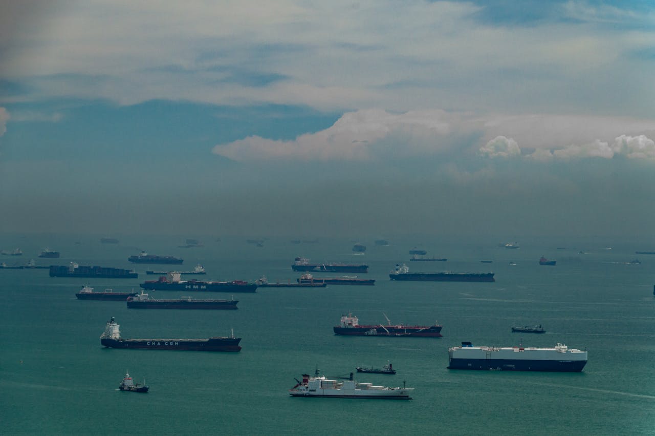 about-01 Vast number of cargo ships navigating through Singapore's busy maritime strait.